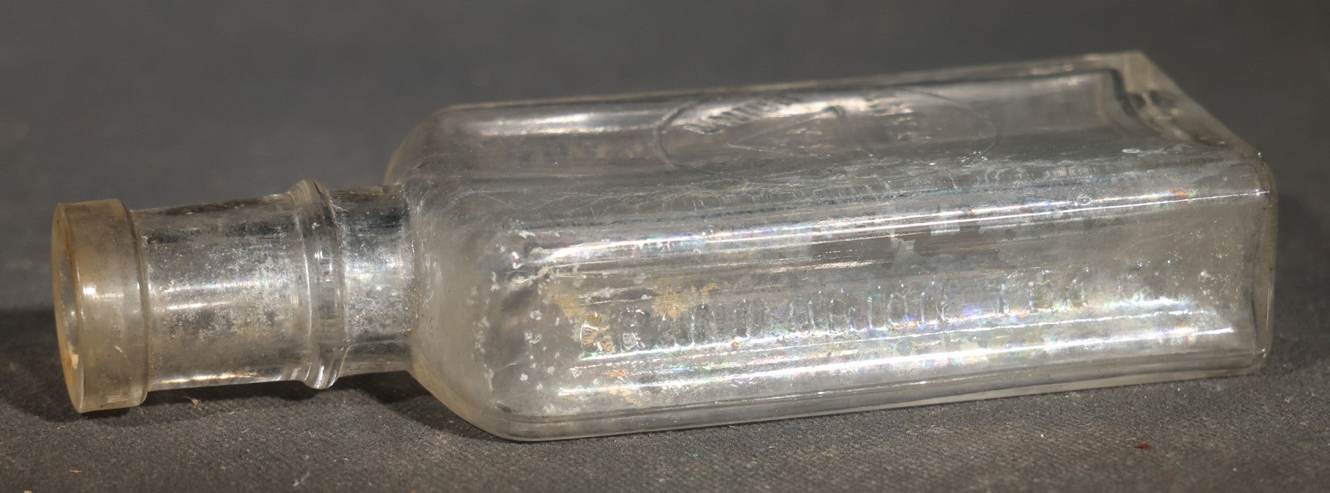 Grouping of Five Antique Embossed Glass Bottles including Remington and Gibbs Sulpho-Napthol