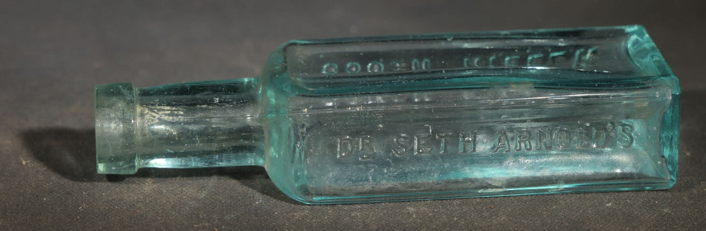 Grouping of Five Antique Embossed Glass Bottles including Remington and Gibbs Sulpho-Napthol