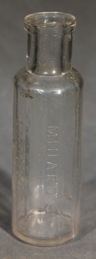 Grouping of Seven Antique Glass Bottles including Ethyl Chloride U.S.P. Anaesthesia Tube and Embossed Pharmaceutical Bottles