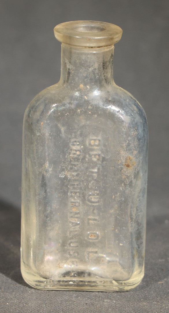 Grouping of Seven Antique Glass Bottles including Ethyl Chloride U.S.P. Anaesthesia Tube and Embossed Pharmaceutical Bottles