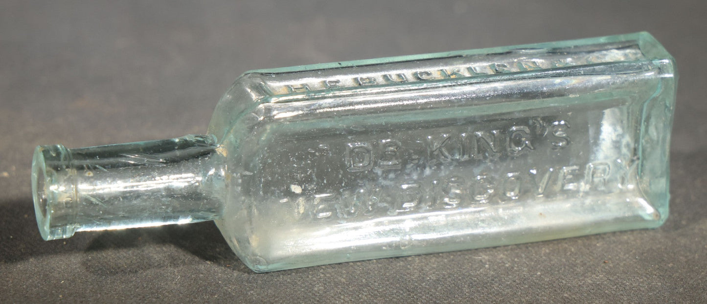 Grouping of Seven Antique Glass Bottles including Ethyl Chloride U.S.P. Anaesthesia Tube and Embossed Pharmaceutical Bottles