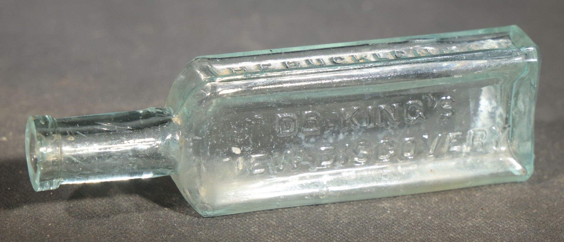 Grouping of Seven Antique Glass Bottles including Ethyl Chloride U.S.P. Anaesthesia Tube and Embossed Pharmaceutical Bottles