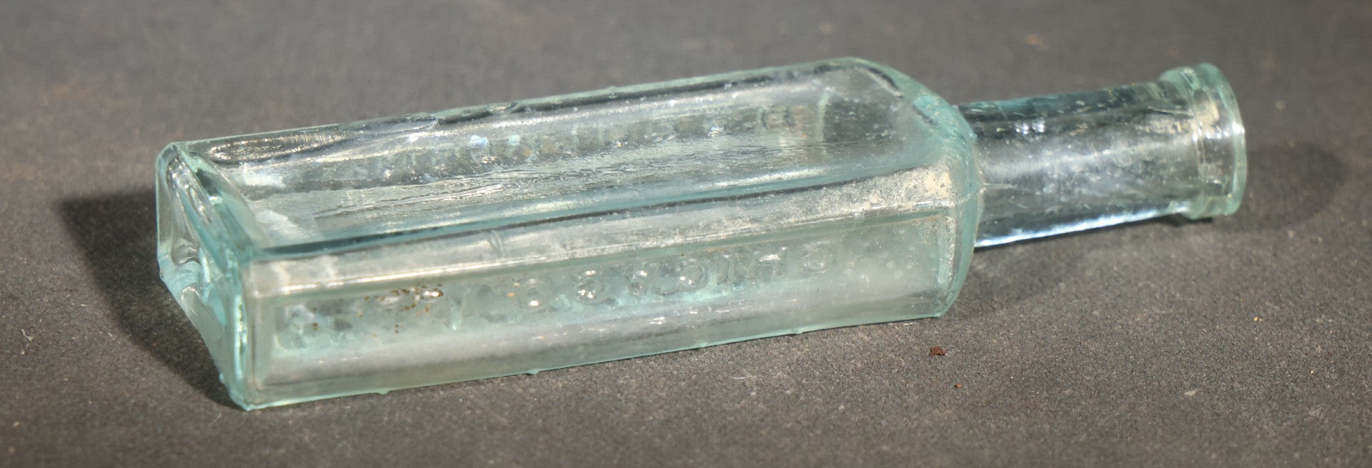Grouping of Seven Antique Glass Bottles including Ethyl Chloride U.S.P. Anaesthesia Tube and Embossed Pharmaceutical Bottles