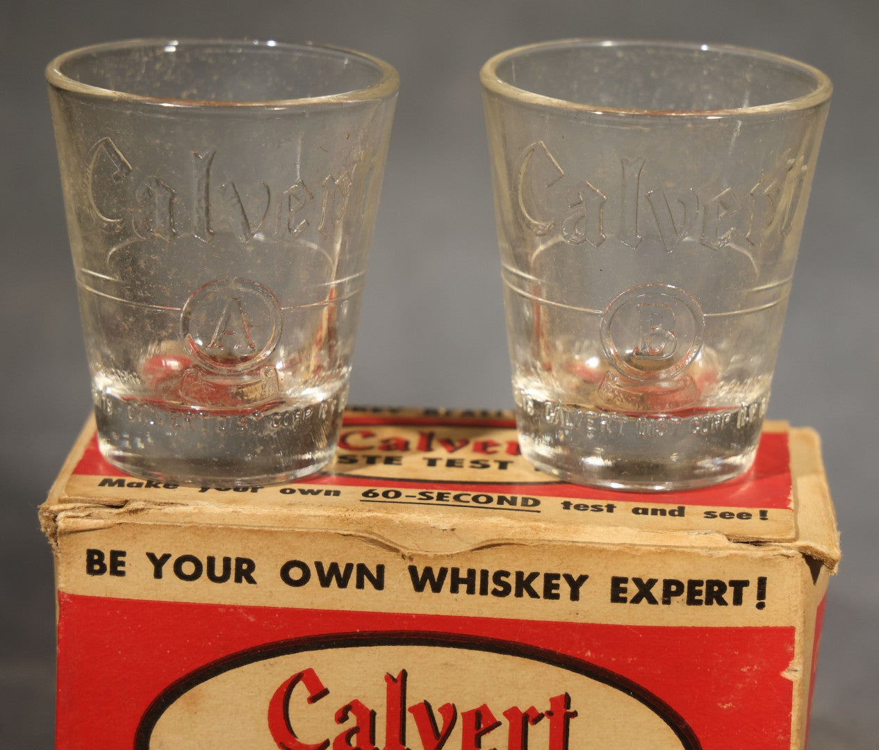 Vintage Calvert Whiskey Taste Test Kit Advertising Novelty with Two Embossed Shot Glasses, "Whiskey Expert" Certificate Cards, and Instruction Pamphlet in Original Box