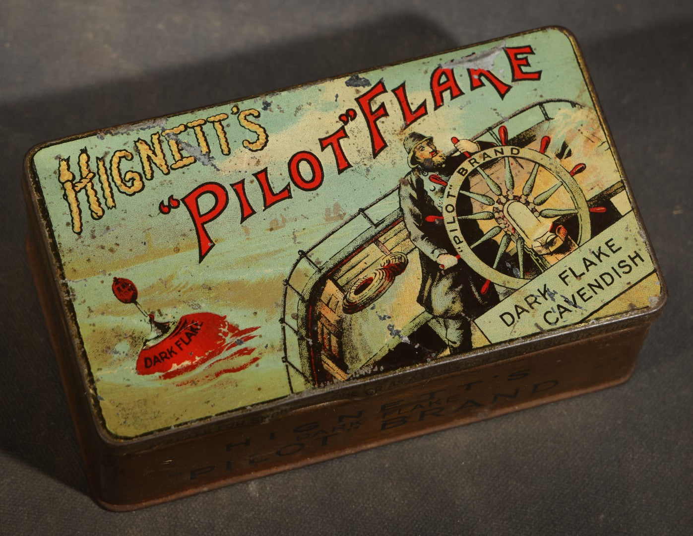 Antique Hignett's "Pilot" Flake Dark Flake Cavendish Tobacco Tin with Ship's Helmsman Graphic