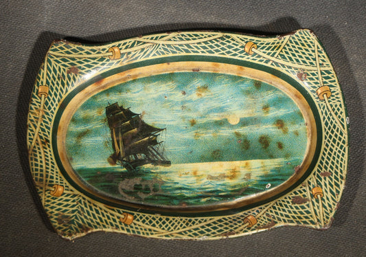 Antique Mascot Crushed Cut Tobacco Lithographed Tin Advertising Tip Tray with Sailing Ship and Fishing Net Border