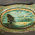 Lot 023 - Antique Mascot Crushed Cut Tobacco Lithographed Tin Advertising Tip Tray with Sailing Ship and Fishing Net Border, 5" L