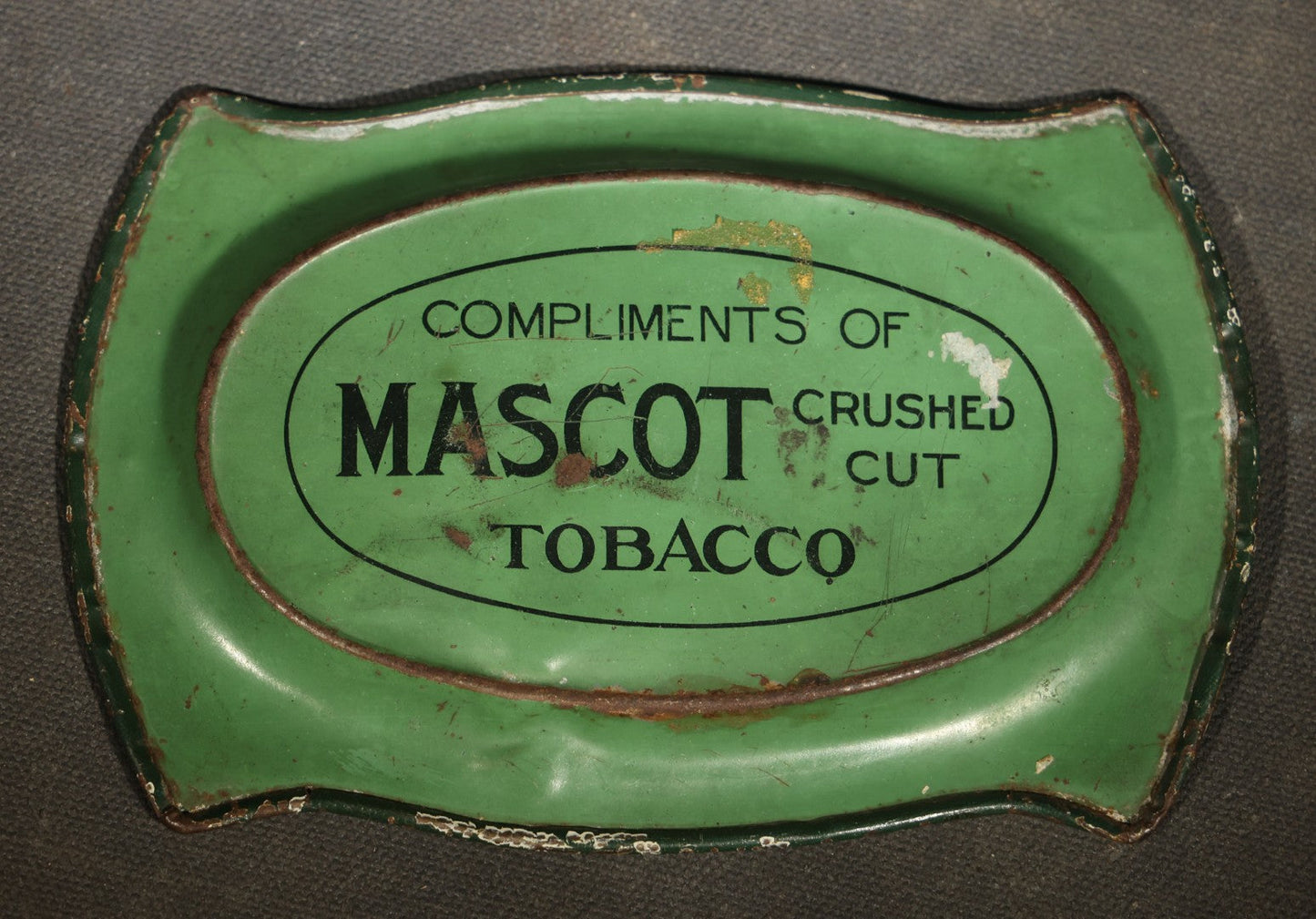 Antique Mascot Crushed Cut Tobacco Lithographed Tin Advertising Tip Tray with Sailing Ship and Fishing Net Border