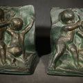 Lot 026 - Pair of Antique Green-Patinated Bookends with Two Putti / Cherubs in Relief, Signed and Dated 1903, Manufactured by WAL Co., 5" H each