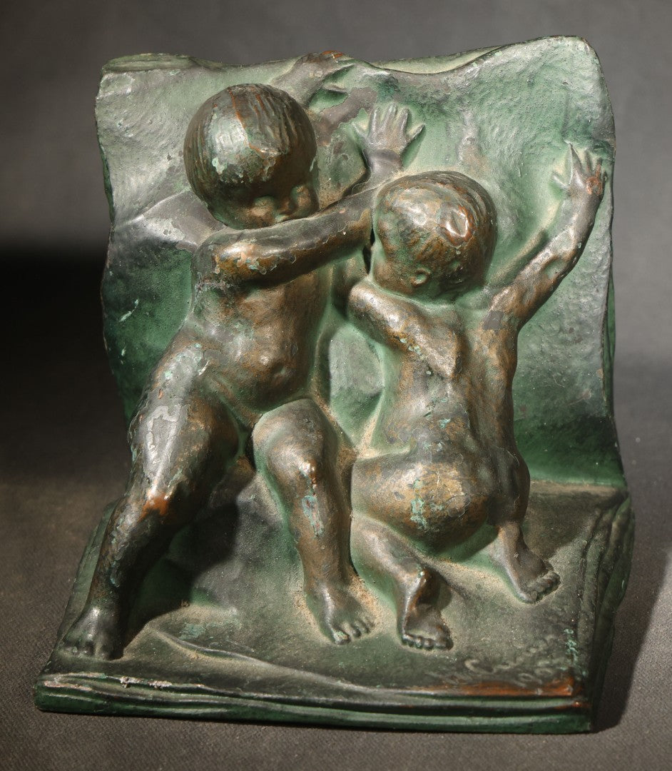 Pair of Antique Green-Patinated Bookends with Two Putti / Cherubs in Relief, Signed and Dated 1903, Manufactured by WAL Co.