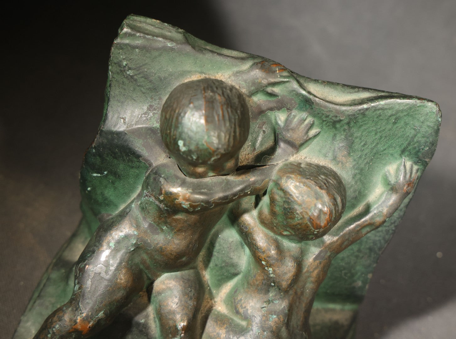 Pair of Antique Green-Patinated Bookends with Two Putti / Cherubs in Relief, Signed and Dated 1903, Manufactured by WAL Co.