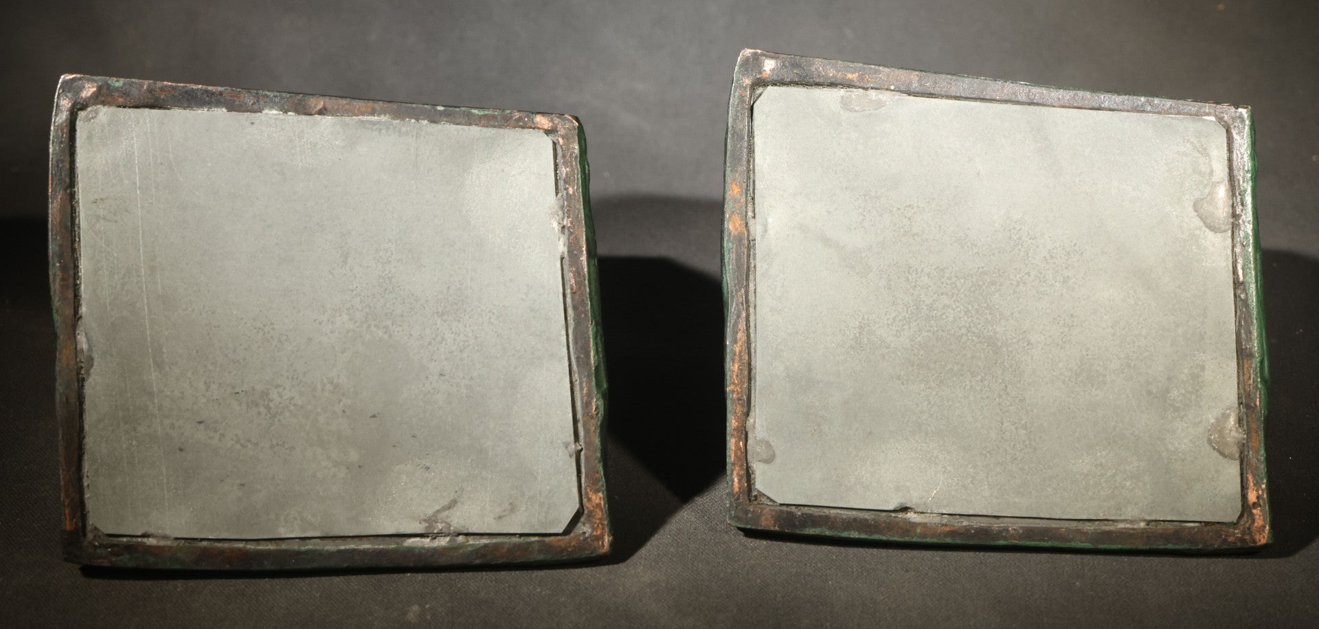 Pair of Antique Green-Patinated Bookends with Two Putti / Cherubs in Relief, Signed and Dated 1903, Manufactured by WAL Co.
