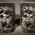Lot 027 - Pair of Antique Figural Bookends with Butterfly-Winged Child Seated Against Book-Form Back, 6-1/4" H each