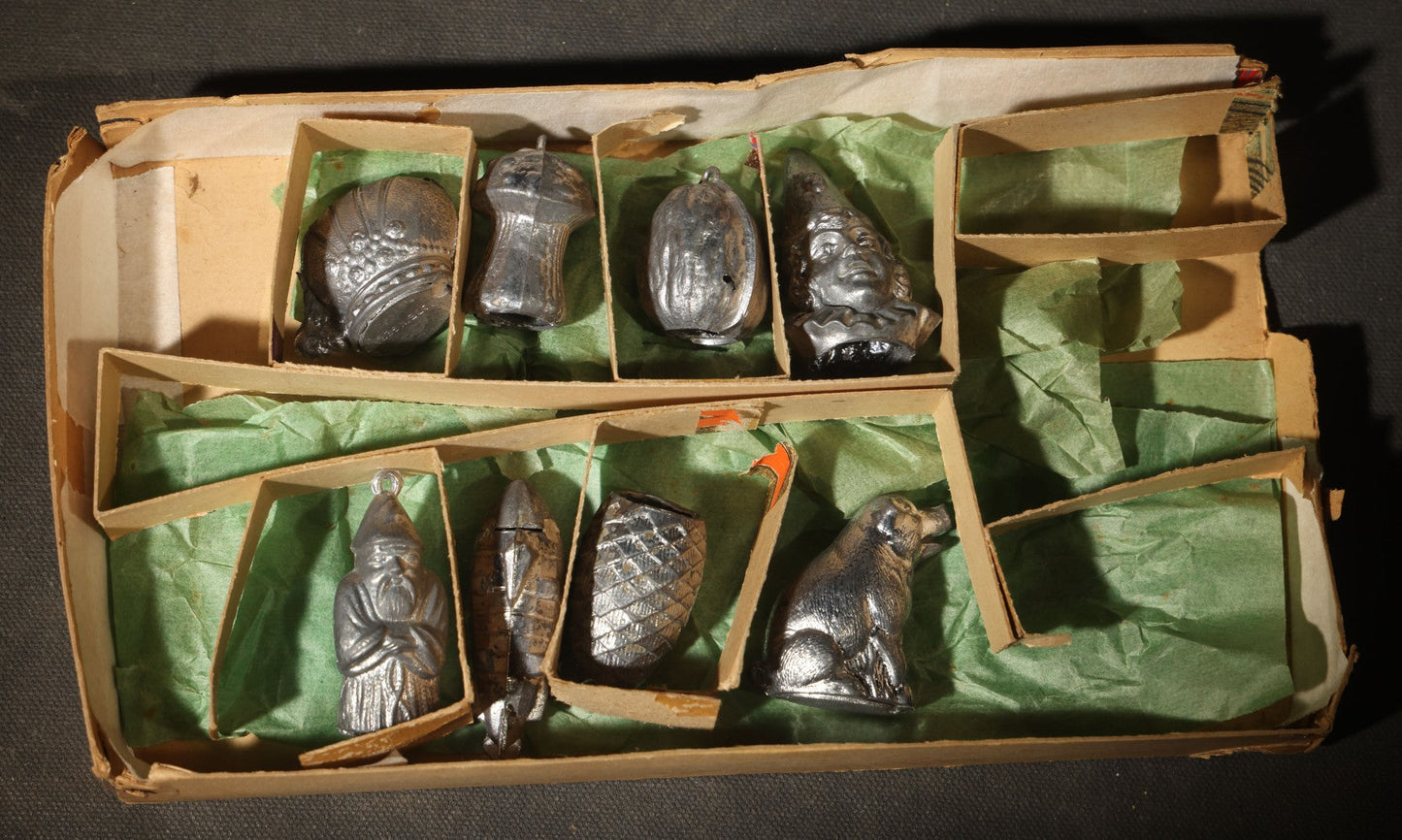 Antique German "Glücks-Figuren mit Scherzeinlagen" ("Lucky Figures with Joke Inserts") Bleigießen Fortune-Telling Set with Eight Lead Figurines including Pig, Zeppelin, Mushroom, and Wizard
