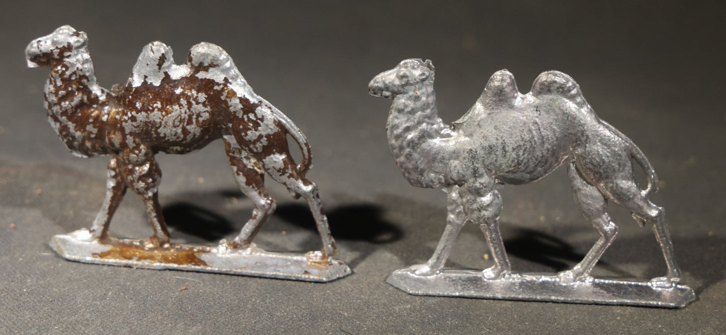 Grouping of Nine Antique German Zinnfiguren Flat Tin Figures including Camels, Lions, Bucking Bronco Rider, and Trees