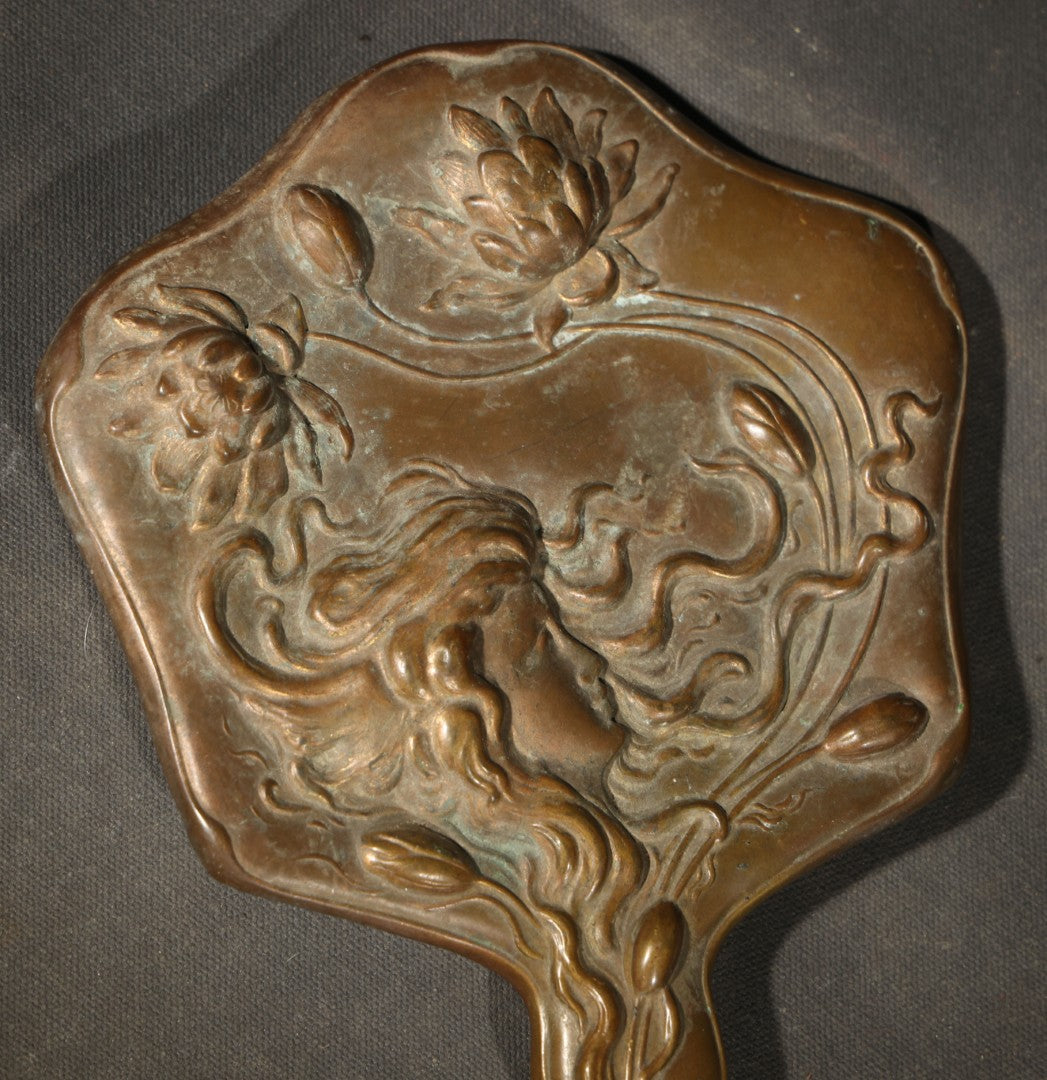 Antique Art Nouveau Repoussé Copper Hand Mirror with Woman and Water Lily Motif, note Mirror in Poor Condition