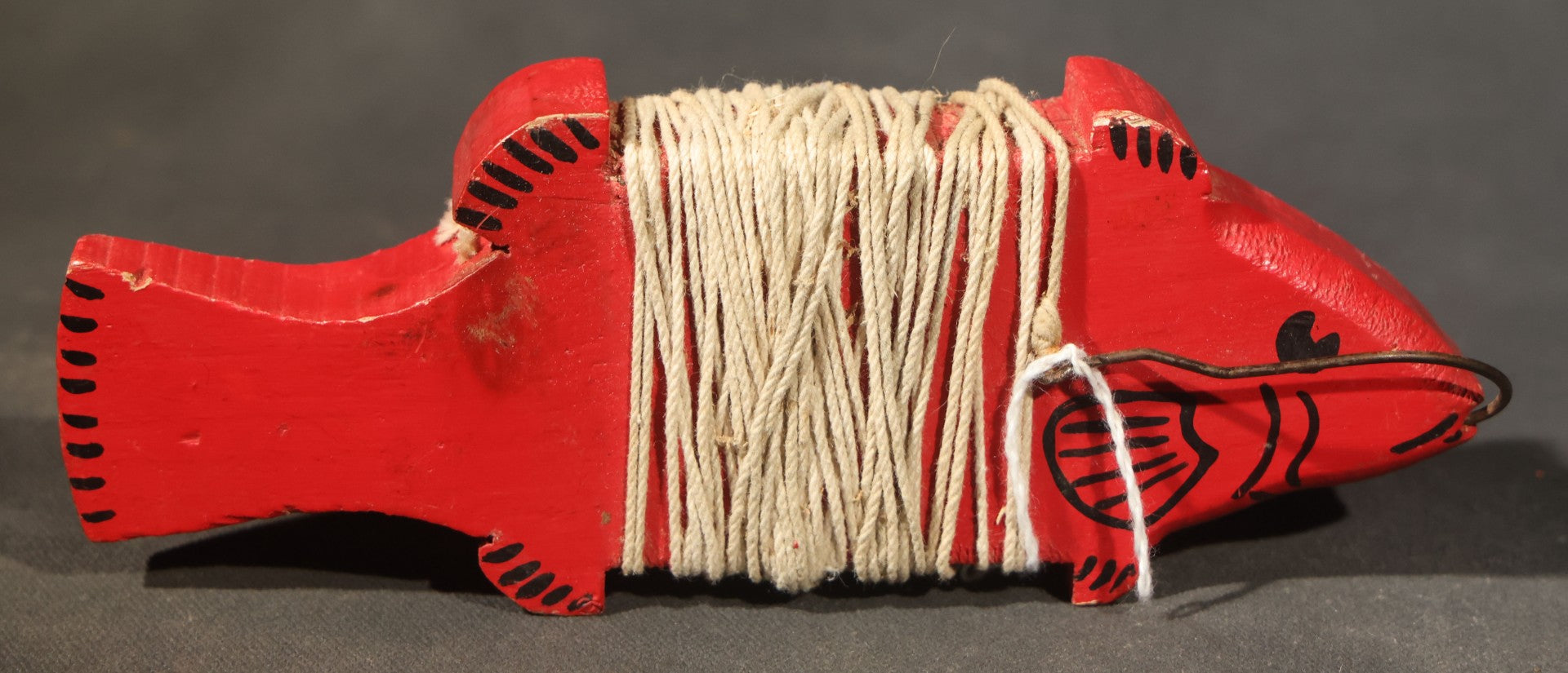 Grouping of Three Antique and Vintage Folk Art Pieces including Bamboo Cup with Crossed American and Cuban Flags, Red Painted Wooden Fish Line Winder, and "Whoopee" Man in Top Hat Figure