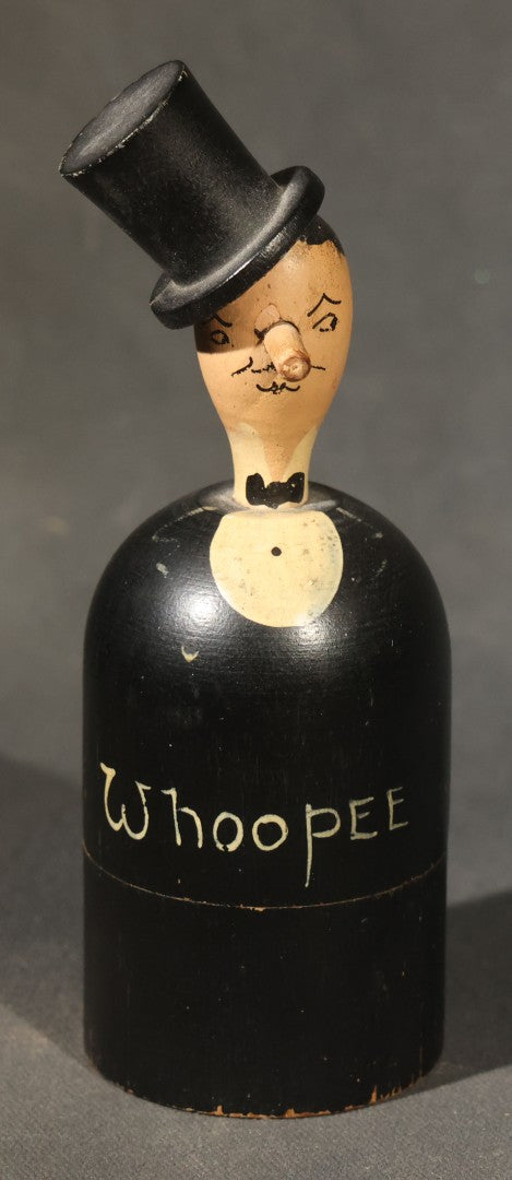 Grouping of Three Antique and Vintage Folk Art Pieces including Bamboo Cup with Crossed American and Cuban Flags, Red Painted Wooden Fish Line Winder, and "Whoopee" Man in Top Hat Figure