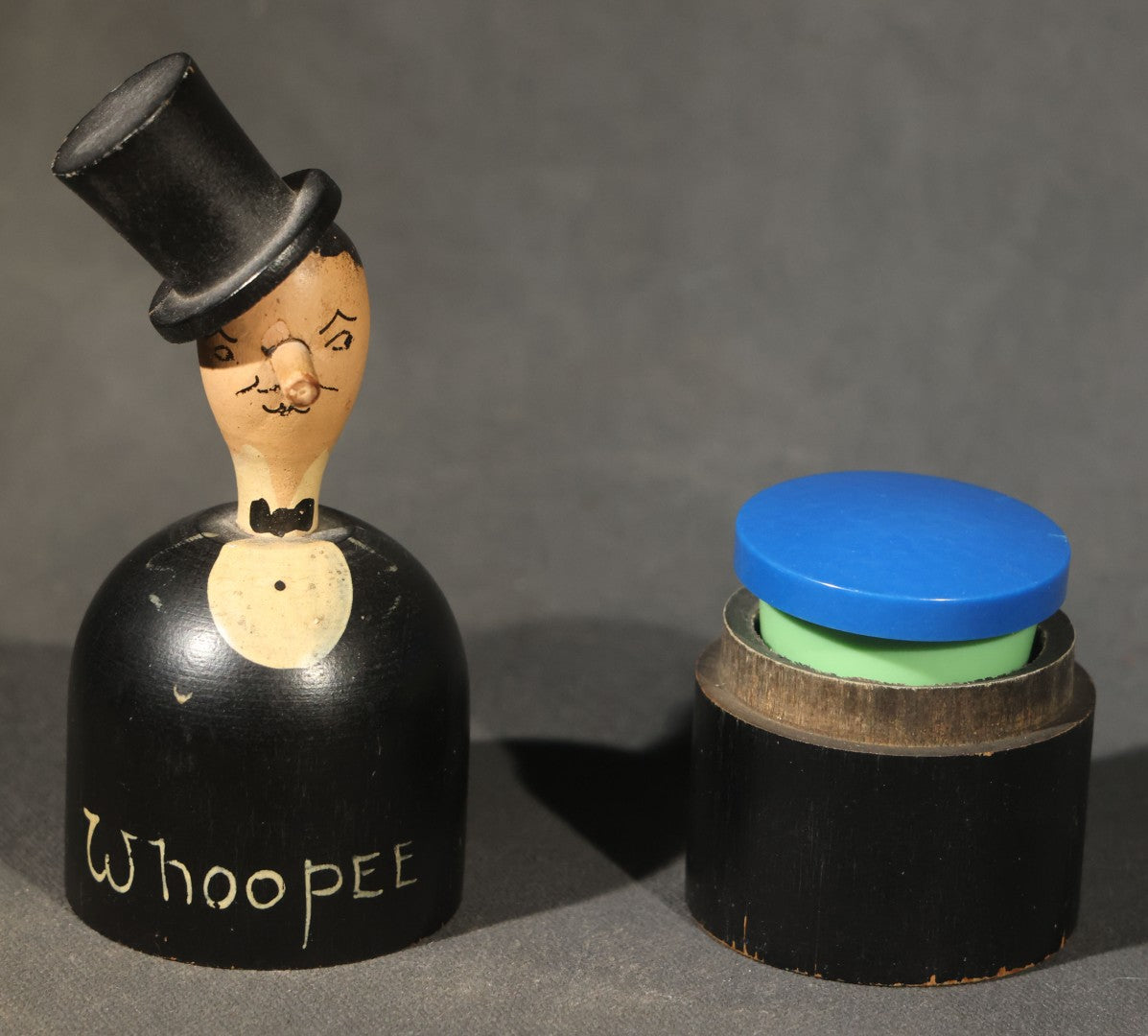 Grouping of Three Antique and Vintage Folk Art Pieces including Bamboo Cup with Crossed American and Cuban Flags, Red Painted Wooden Fish Line Winder, and "Whoopee" Man in Top Hat Figure