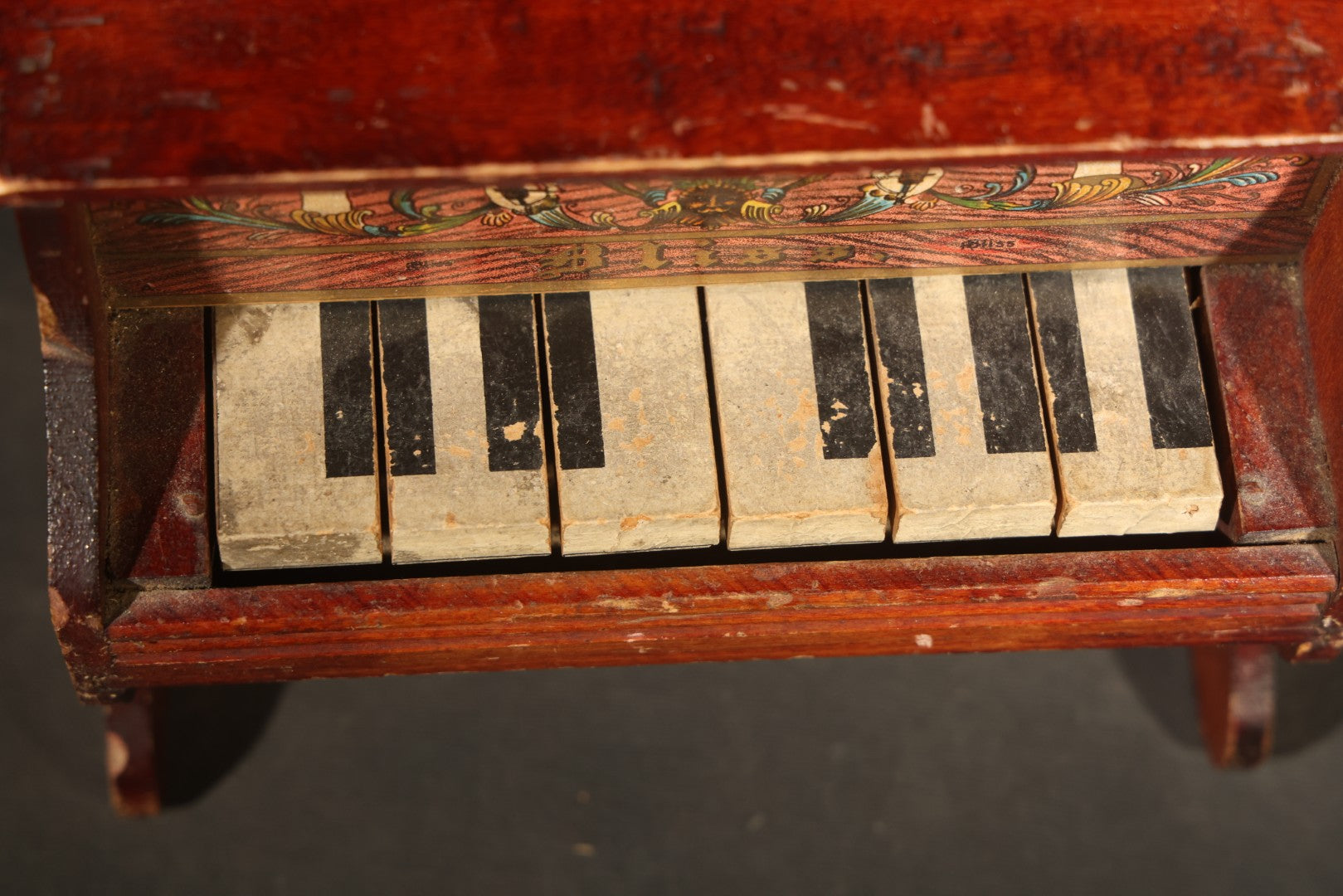 Antique Bliss Wooden Toy Piano with Lithographed Cherub and Scroll Graphics, Eight Keys