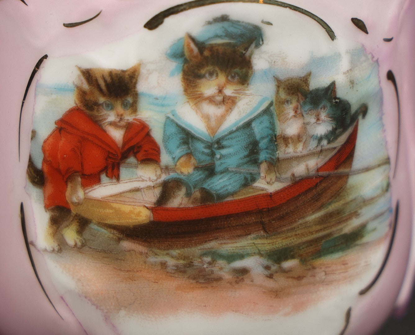 Antique German Pink Porcelain Demitasse Cup and Saucer with Anthropomorphic Cats in a Rowboat, Note Chip to Handle