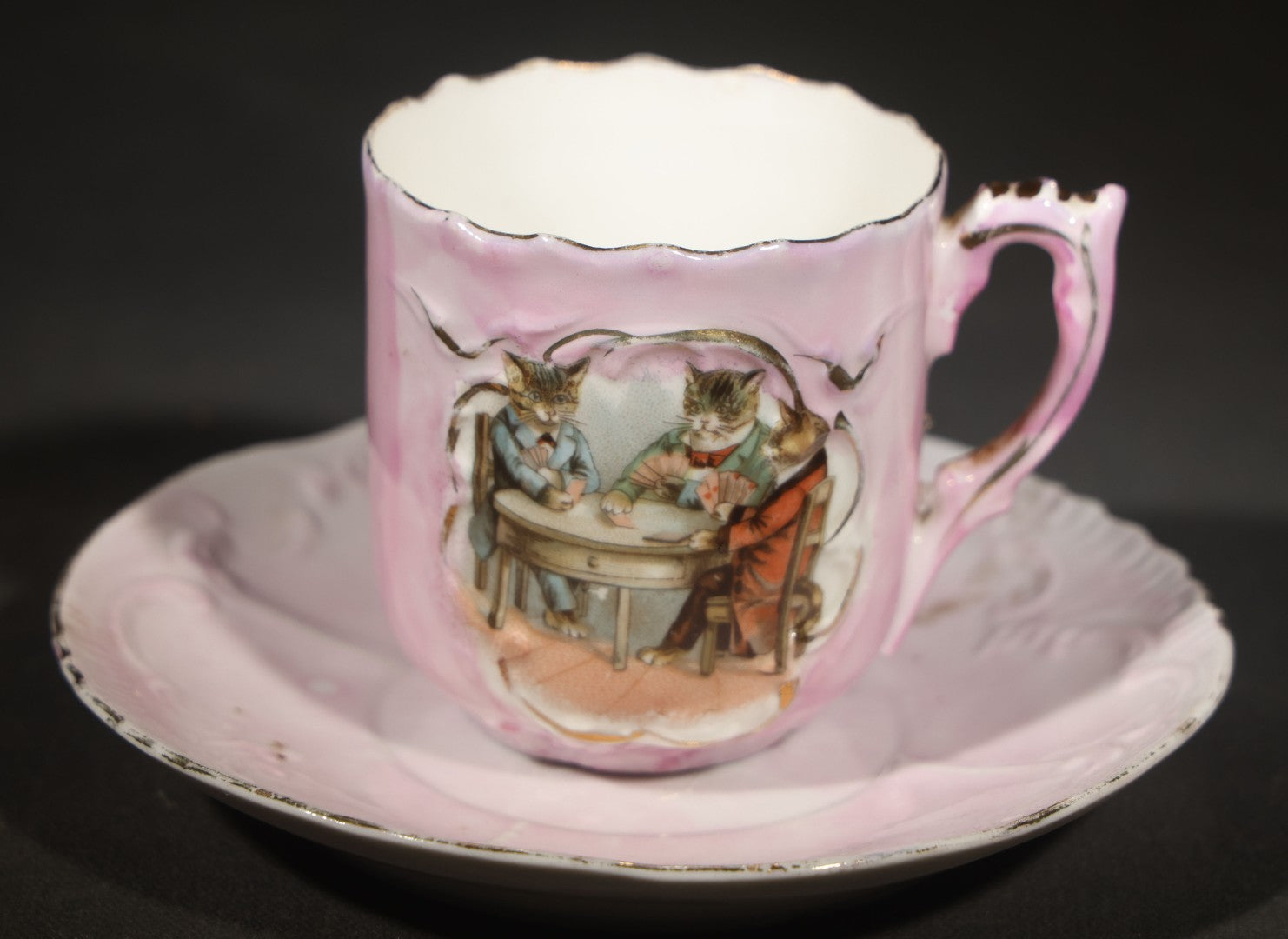 Antique German Pink Porcelain Demitasse Cup and Saucer with Anthropomorphic Cats Playing Cards, Note Chip to Handle