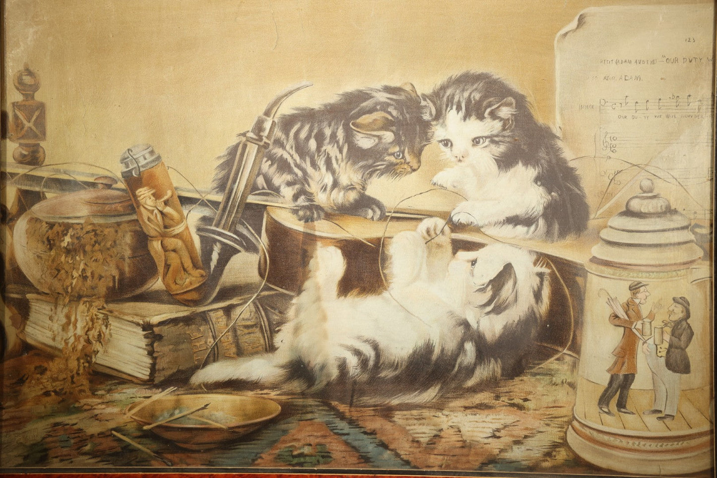 Antique Framed Chromolithograph Print of Three Cats Playing with a Violin, With Sheet Music, Books, and Stein In Scene