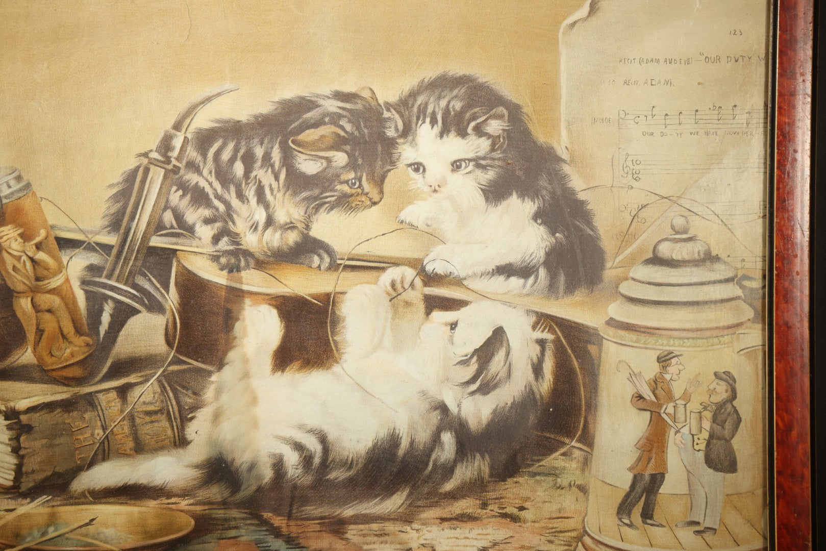 Antique Framed Chromolithograph Print of Three Cats Playing with a Violin, With Sheet Music, Books, and Stein In Scene