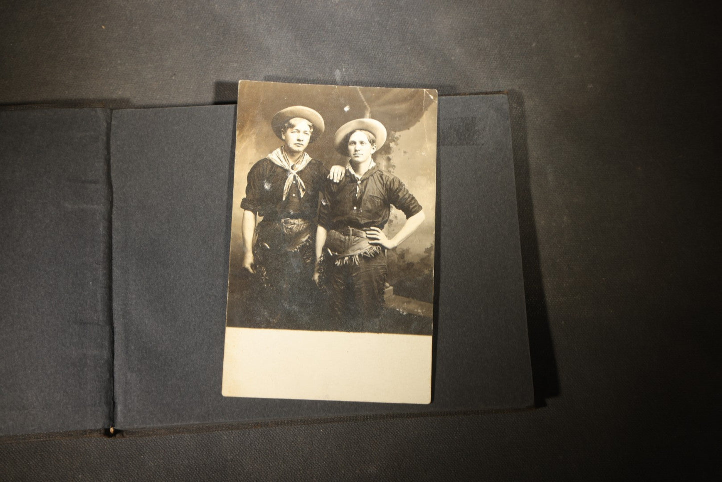 Antique Snapshot Photo Album Containing 25+ Photographs, Circa 1910, Including Beach Scenes, R.P.P.C. of Two Young Men in Cowboy Attire, Sailboat, Swans, Castle Architecture, and Family Portraits