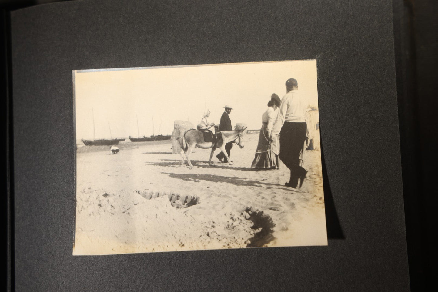Antique Snapshot Photo Album Containing 25+ Photographs, Circa 1910, Including Beach Scenes, R.P.P.C. of Two Young Men in Cowboy Attire, Sailboat, Swans, Castle Architecture, and Family Portraits