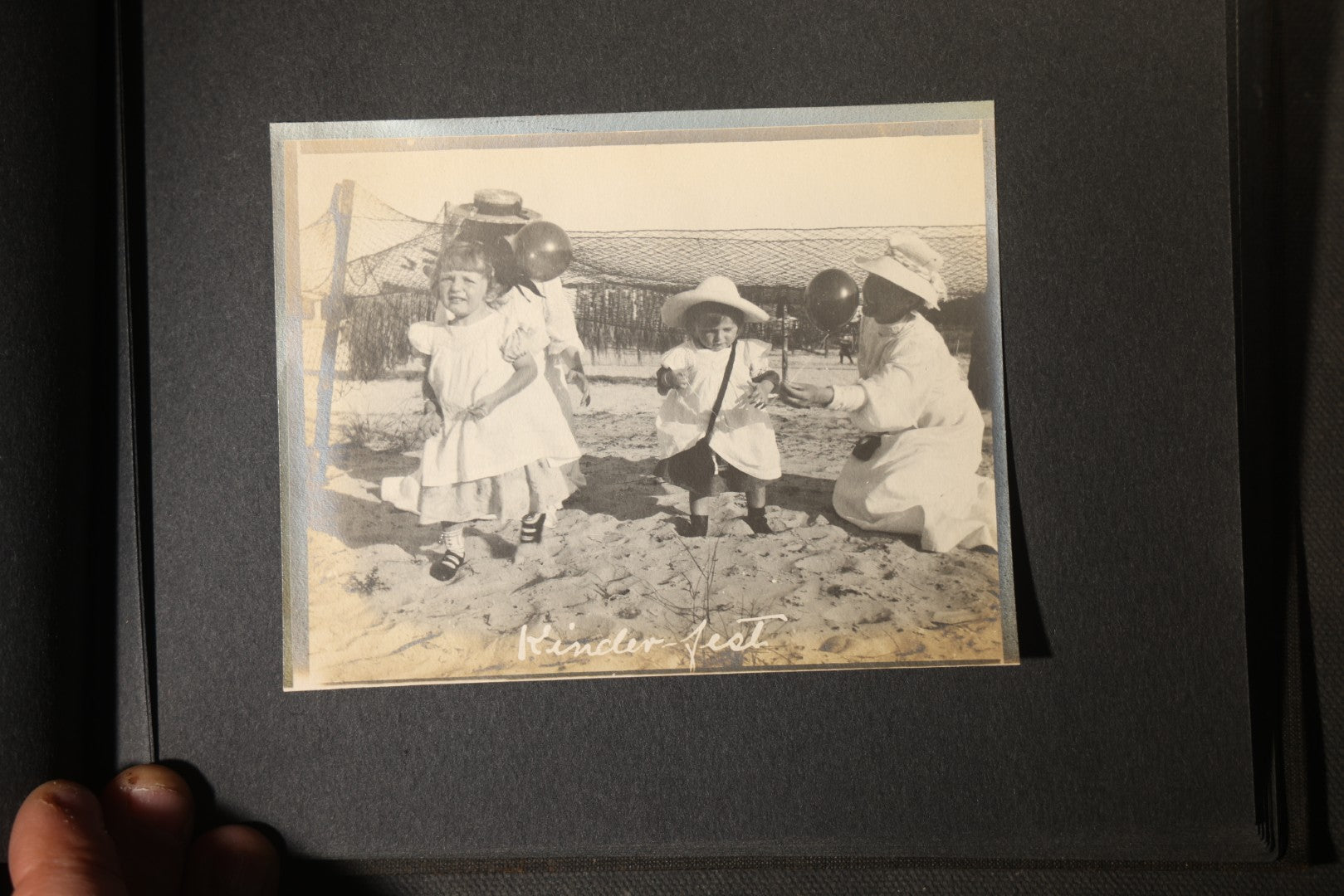 Antique Snapshot Photo Album Containing 25+ Photographs, Circa 1910, Including Beach Scenes, R.P.P.C. of Two Young Men in Cowboy Attire, Sailboat, Swans, Castle Architecture, and Family Portraits
