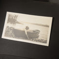 Lot 082 - Antique Snapshot Photo Album Containing 30+ Photographs, Circa 1910s-1920s, Including Lake and Boating Scenes, Steamboat at Dock, Women Fishing, Swimming, Woman with Dog, and Child with Flag-Decorated Automobile