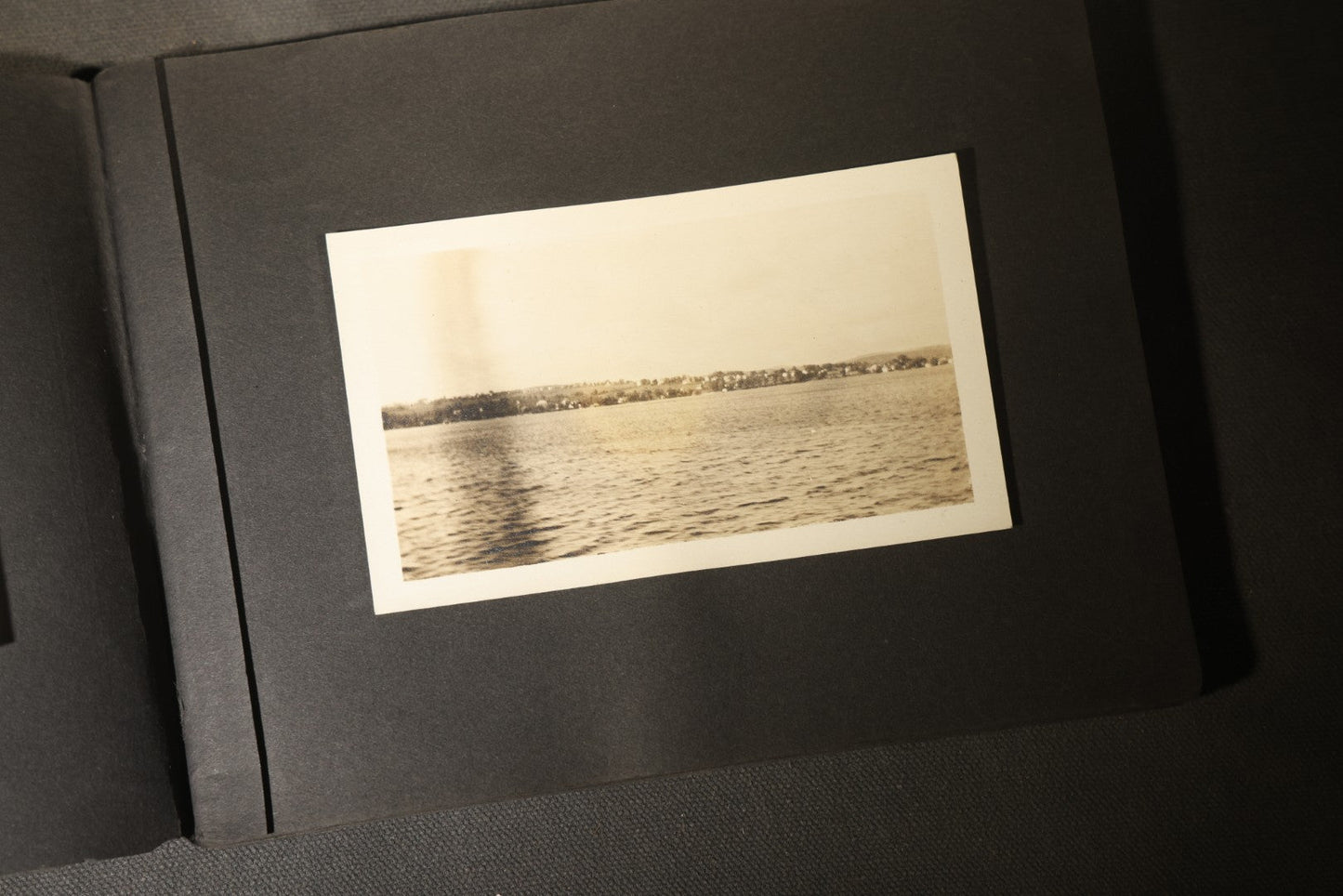 Antique Snapshot Photo Album Containing 30+ Photographs, Circa 1910s-1920s, including Lake and Boating Scenes, Steamboat at Dock, Women Fishing, Swimming, Woman with Dog, and Child with Flag-Decorated Automobile