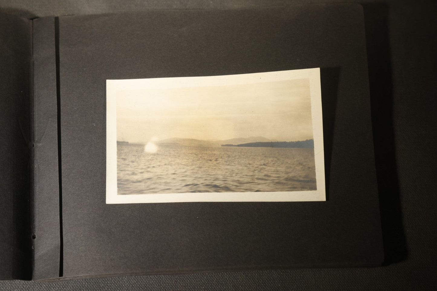 Antique Snapshot Photo Album Containing 30+ Photographs, Circa 1910s-1920s, including Lake and Boating Scenes, Steamboat at Dock, Women Fishing, Swimming, Woman with Dog, and Child with Flag-Decorated Automobile