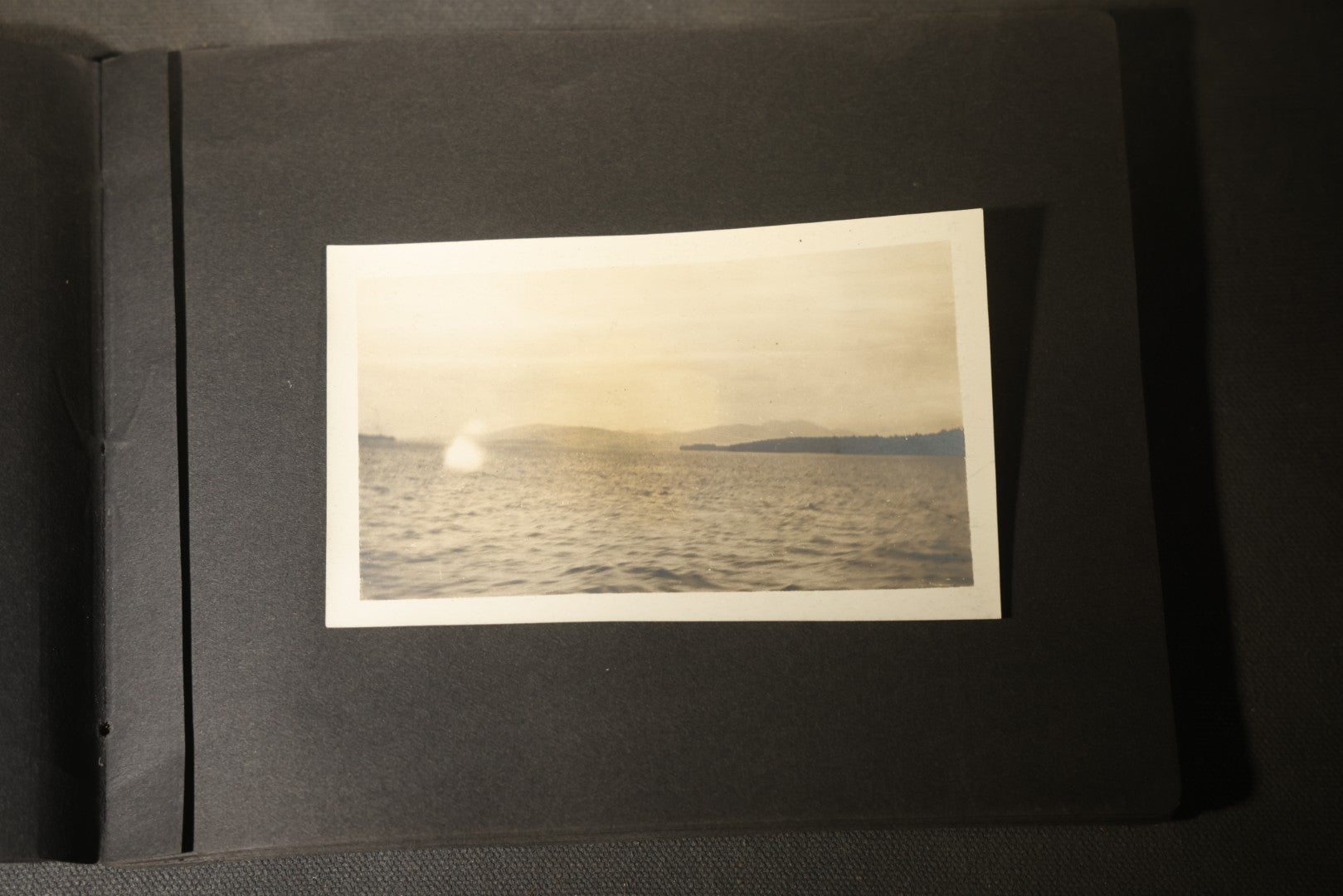 Antique Snapshot Photo Album Containing 30+ Photographs, Circa 1910s-1920s, including Lake and Boating Scenes, Steamboat at Dock, Women Fishing, Swimming, Woman with Dog, and Child with Flag-Decorated Automobile