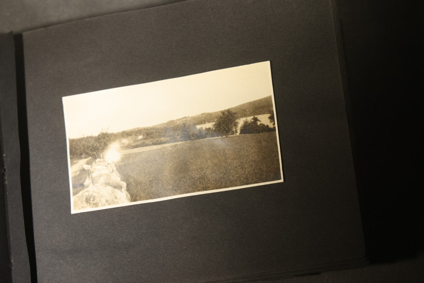 Antique Snapshot Photo Album Containing 30+ Photographs, Circa 1910s-1920s, including Lake and Boating Scenes, Steamboat at Dock, Women Fishing, Swimming, Woman with Dog, and Child with Flag-Decorated Automobile