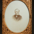 Lot 084 - Antique Half-Plate Opalotype Photograph of a Bearded Elderly Man in Suit and Bow Tie with Embossed Brass Mat and Preserver, 4-1/4" W x 5-1/2" H