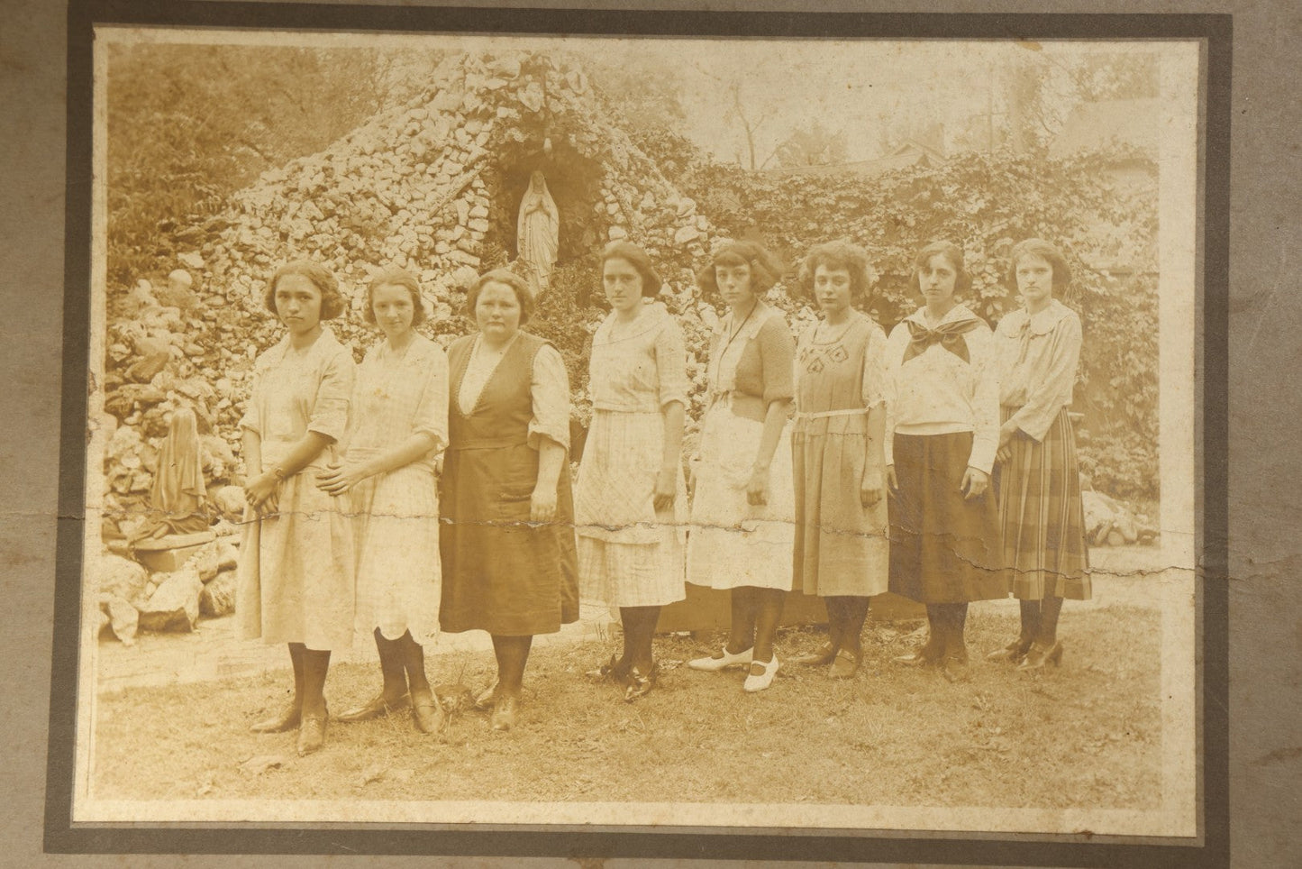 Antique Board-Mounted Photograph of Eight Young Women Posed Before a Religious Grotto with Marian Statue