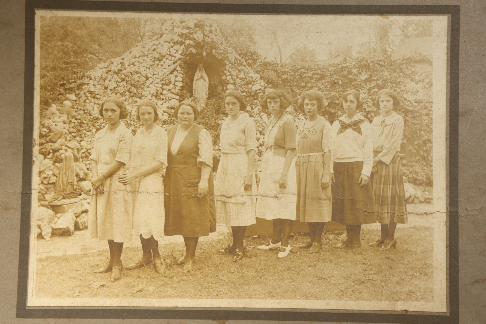 Antique Board-Mounted Photograph of Eight Young Women Posed Before a Religious Grotto with Marian Statue