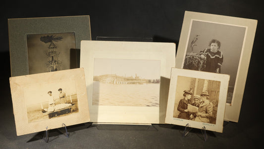Grouping of Five Antique Board-Mounted Photographs including Sunken Paddle Wheel Steamboat Inscribed "Sunk on Currier Rock 1903," German Christmas Pyramid, and Child with Taxidermy Bird by Nicholas, Bristol, New Hampshire
