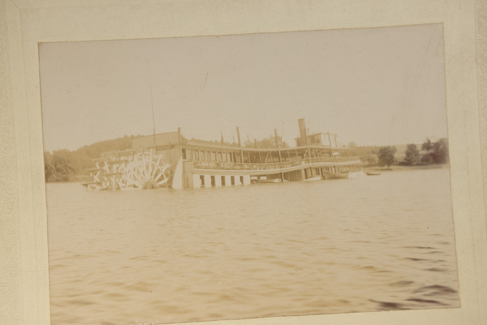 Grouping of Five Antique Board-Mounted Photographs including Sunken Paddle Wheel Steamboat Inscribed "Sunk on Currier Rock 1903," German Christmas Pyramid, and Child with Taxidermy Bird by Nicholas, Bristol, New Hampshire