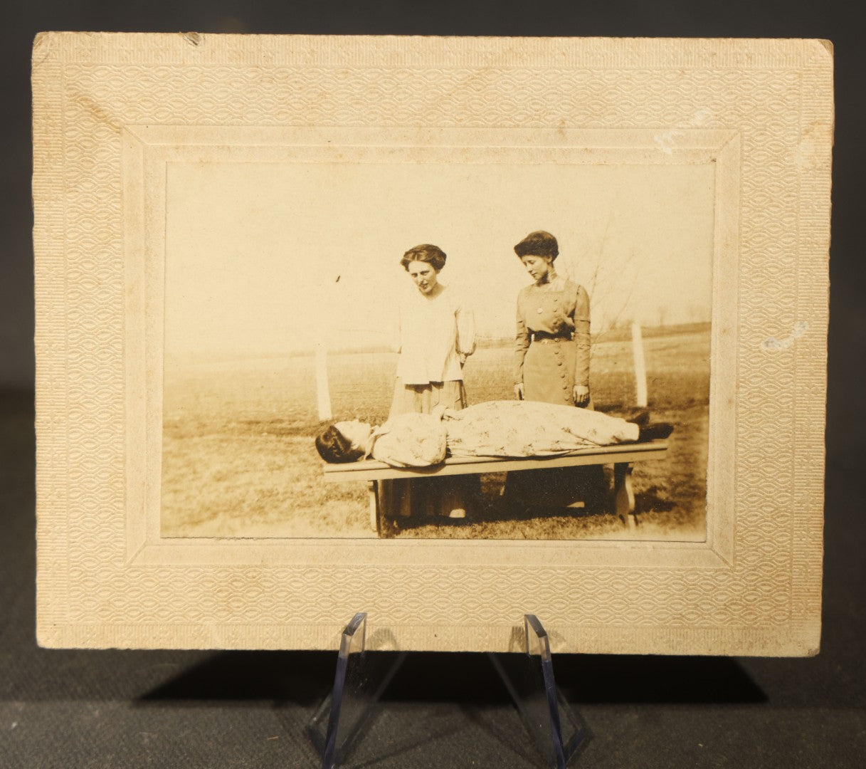 Grouping of Five Antique Board-Mounted Photographs including Sunken Paddle Wheel Steamboat Inscribed "Sunk on Currier Rock 1903," German Christmas Pyramid, and Child with Taxidermy Bird by Nicholas, Bristol, New Hampshire