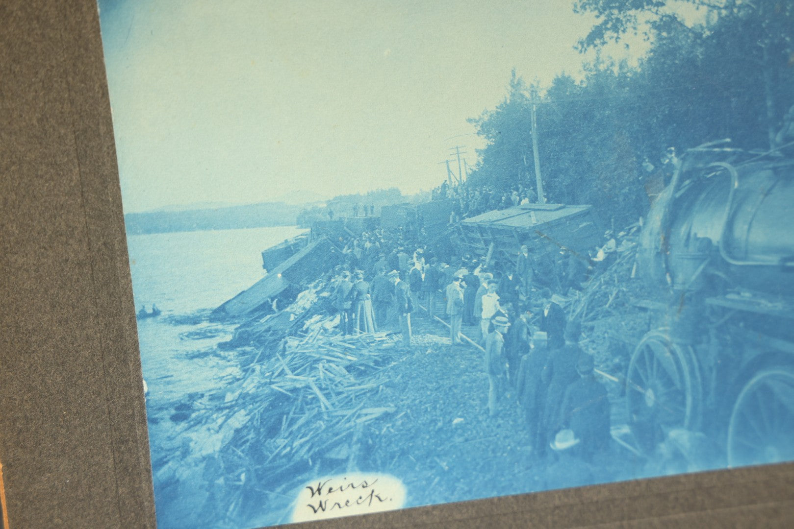 Grouping of 12 Antique Cyanotype Photographs including "Weirs Wreck" Train Derailment, Occupational Newspaper Deliveryman with "The Sun" Cart, Naval Warships, Cyanotype on Birch Bark, Man with Bicycle, and Photo Gallery Interior