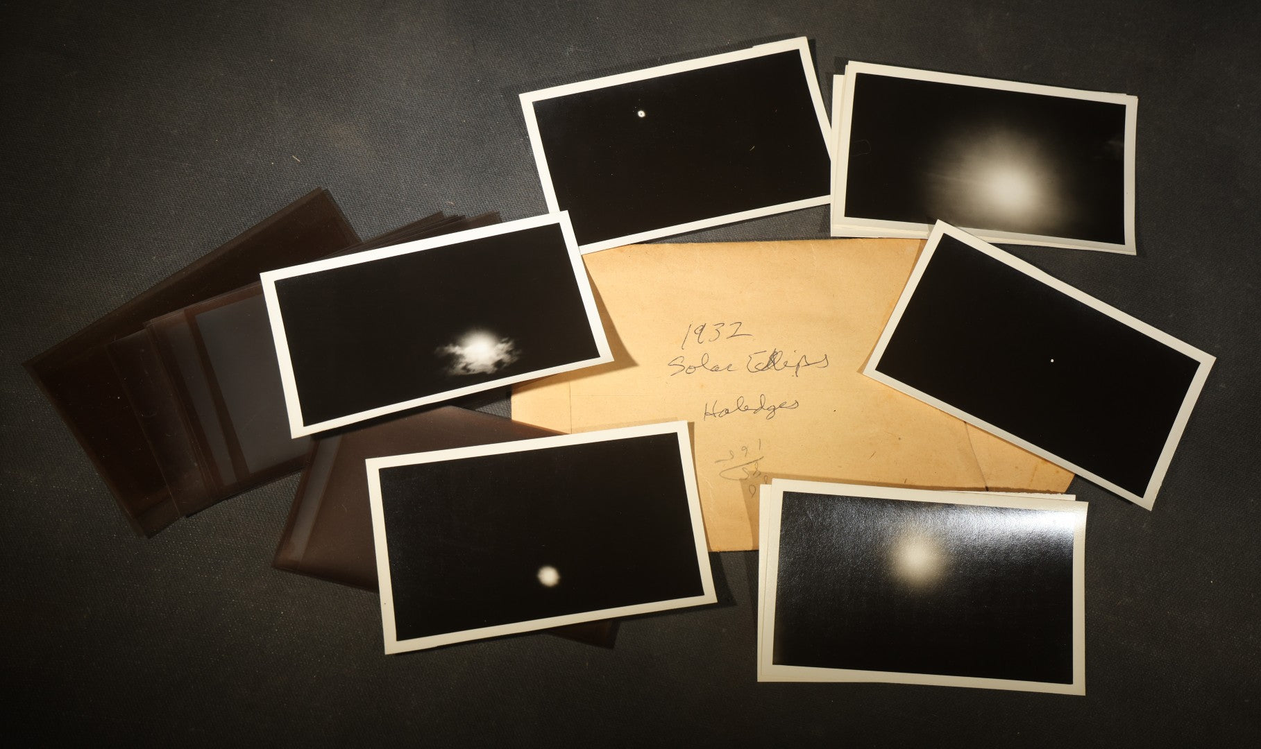 Grouping of 11 Vintage Snapshot Photographs with Negatives of the 1932 Solar Eclipse including Partial and Total Eclipse Phases and Eclipse Viewers with American Flag