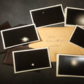 Lot 094 - Grouping of 11 Vintage Snapshot Photographs with Negatives of the 1932 Solar Eclipse Including Partial and Total Eclipse Phases and Eclipse Viewers with American Flag