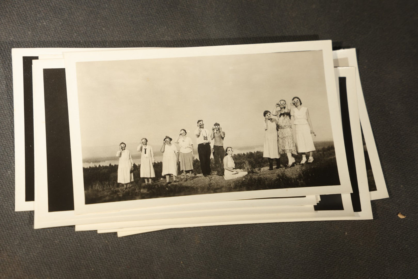 Grouping of 11 Vintage Snapshot Photographs with Negatives of the 1932 Solar Eclipse including Partial and Total Eclipse Phases and Eclipse Viewers with American Flag