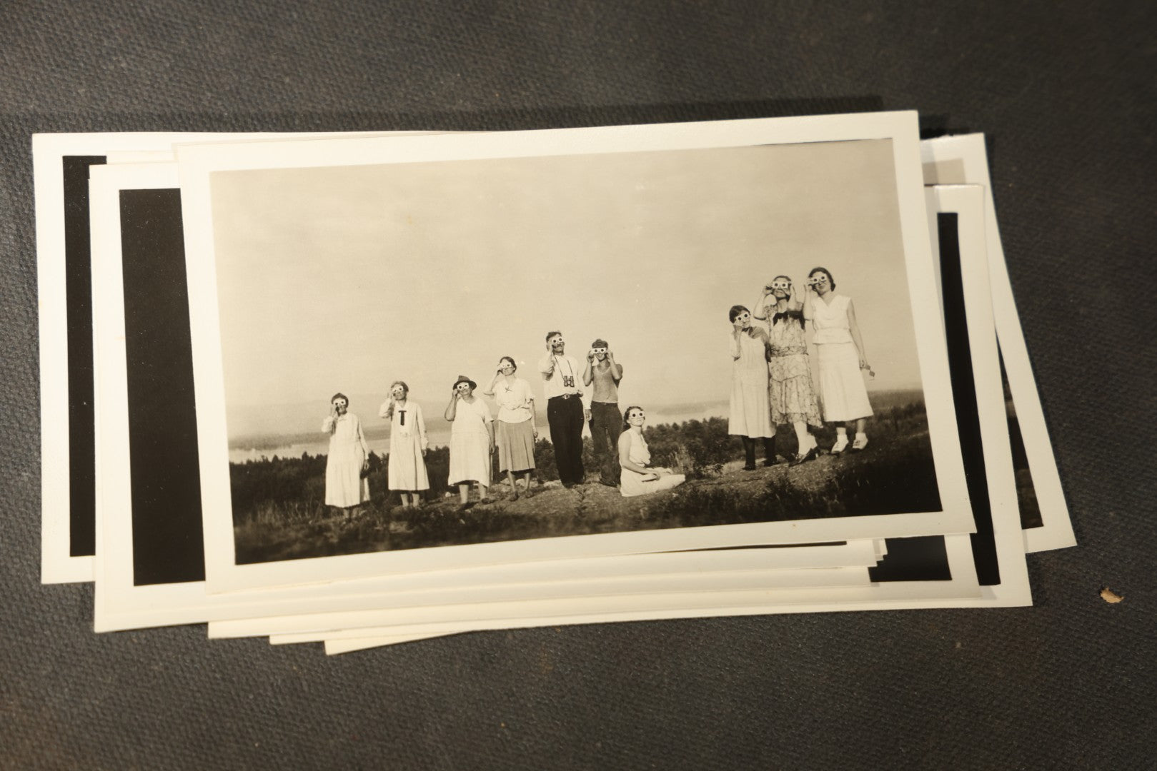 Grouping of 11 Vintage Snapshot Photographs with Negatives of the 1932 Solar Eclipse including Partial and Total Eclipse Phases and Eclipse Viewers with American Flag