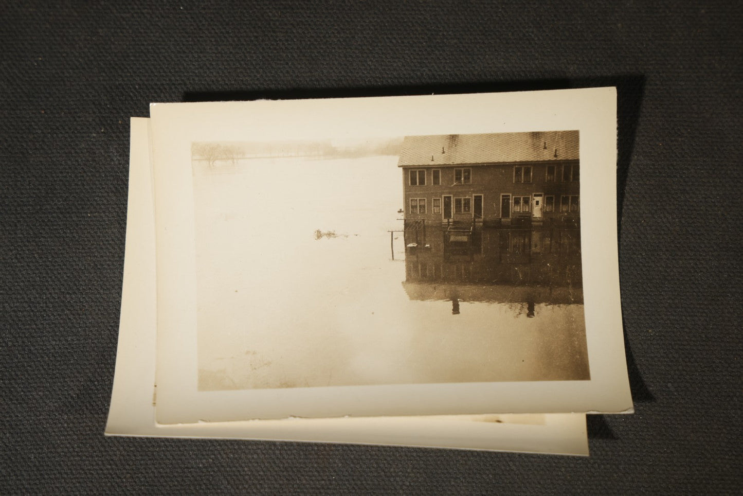 Vintage Grouping of Approximately 40 Snapshot Photographs and Negatives Documenting a Flood in Nashua, New Hampshire, in Fred W. Perkins Photo Finishing Envelope Marked "Flood Films"