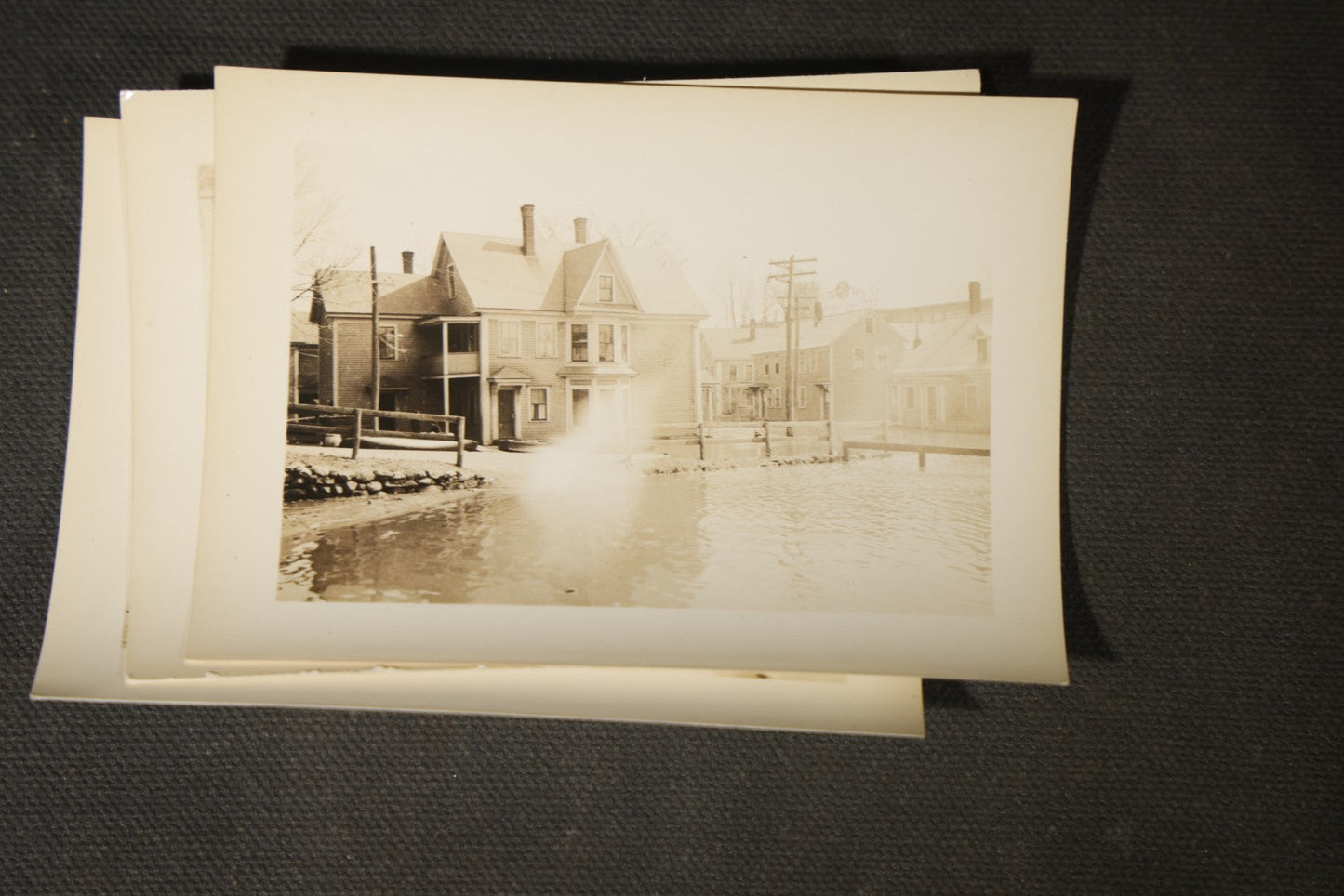 Vintage Grouping of Approximately 40 Snapshot Photographs and Negatives Documenting a Flood in Nashua, New Hampshire, in Fred W. Perkins Photo Finishing Envelope Marked "Flood Films"