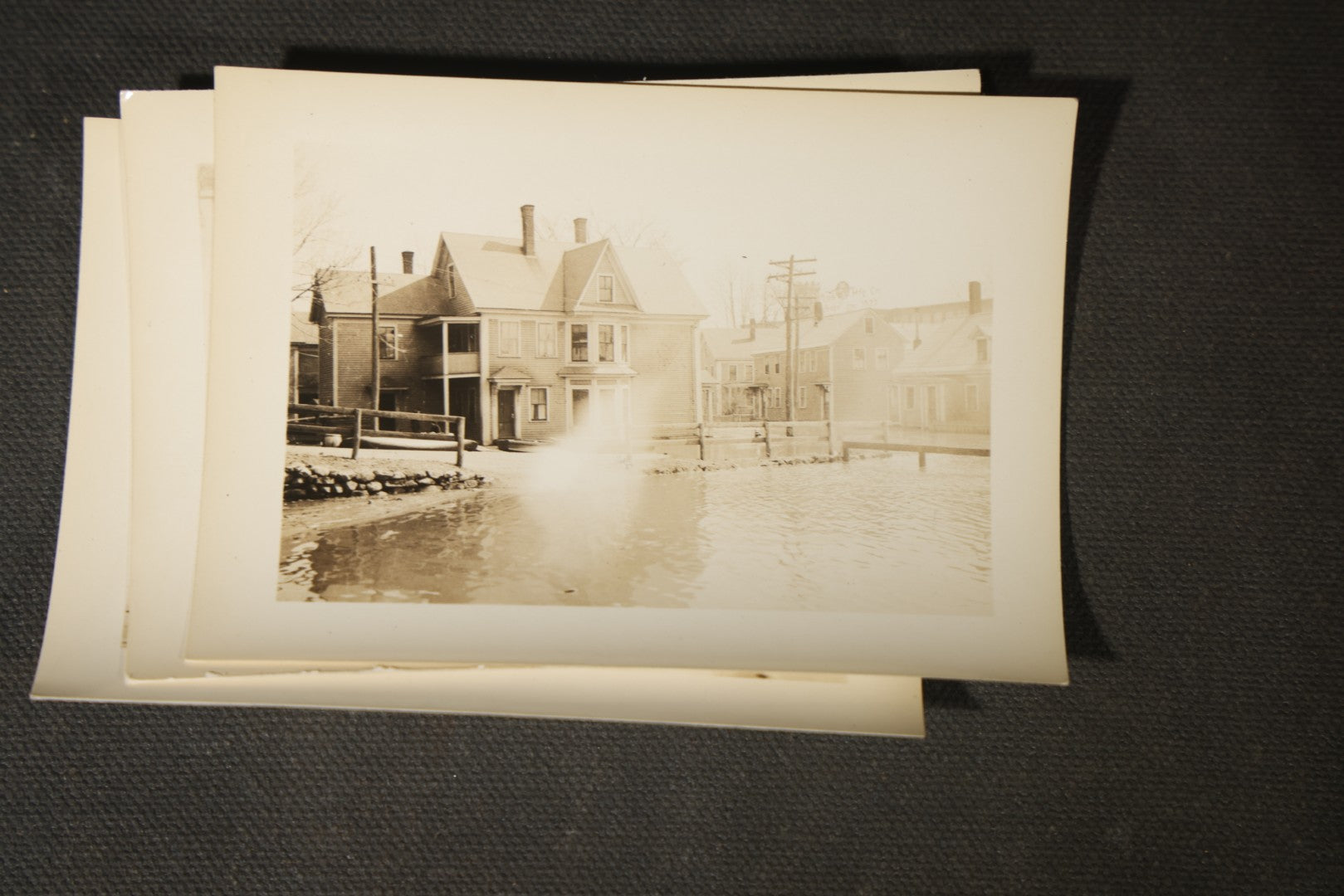Vintage Grouping of Approximately 40 Snapshot Photographs and Negatives Documenting a Flood in Nashua, New Hampshire, in Fred W. Perkins Photo Finishing Envelope Marked "Flood Films"